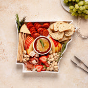 charcuterie board with cheese and cured meats in a arkansas shaped serving tray platter dish
