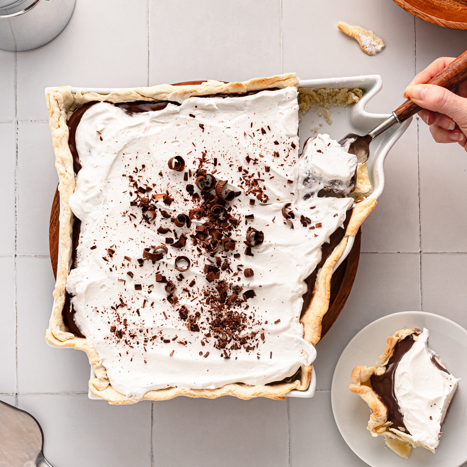 chocolate and cream pie in a white pie dish shaped like Arkansas