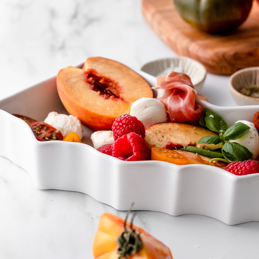 Close up of the outside of the California state plate, wavy lines, unique silhouette.