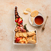 charcuterie board with cheese and cured meats in a Idaho shaped serving tray platter dish