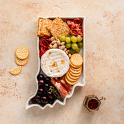 charcuterie board with cheese and cured meats in a Indiana shaped serving tray platter dish