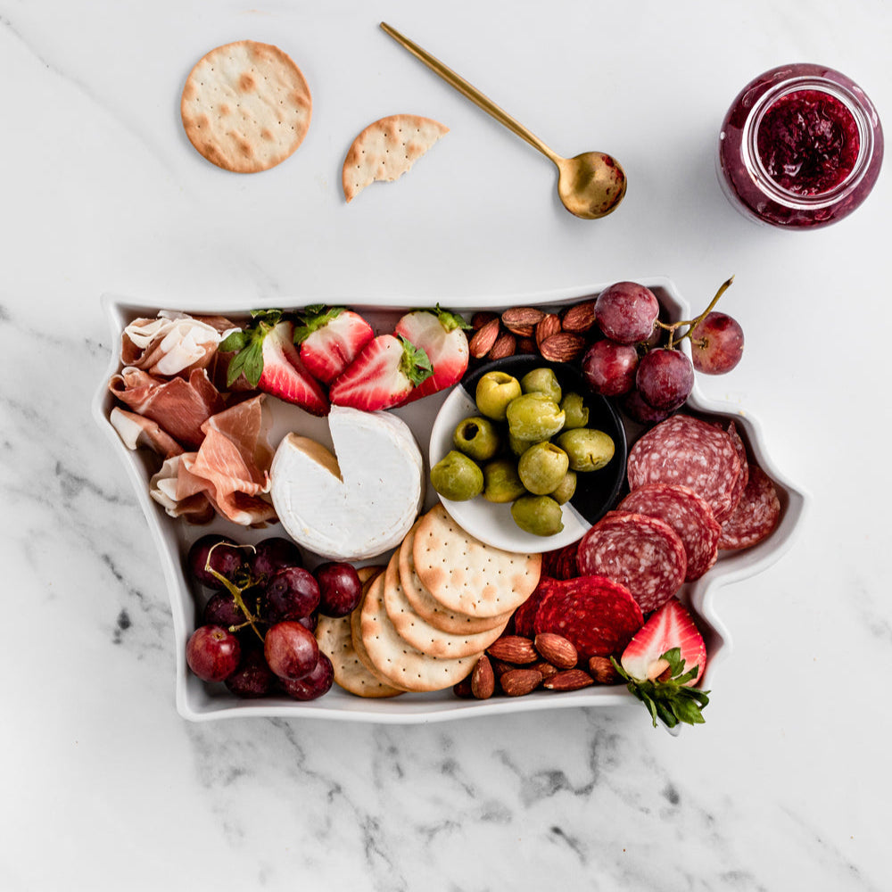 charcuterie board with cheese and cured meats in a Iowa shaped serving tray platter dish