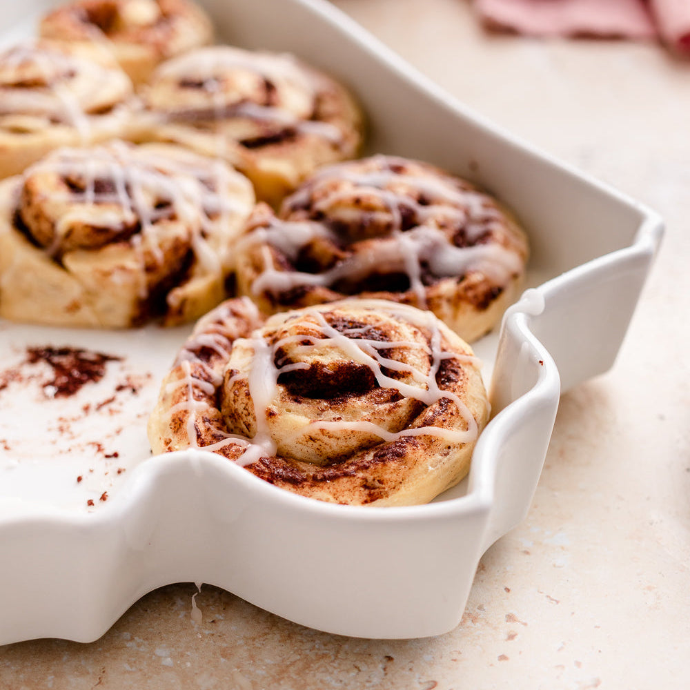 Close up outside of plate, unique silhouette. Iowa State Plate with cIowa State Plate cinnamon rolls. Iowa baking dish. Iowa dessert dish. Iowa Pie plate. IA pie plate. IA bakeware. IA gift. Iowa gift. Iowa kitchen gift. Iowa cooking gift. 
