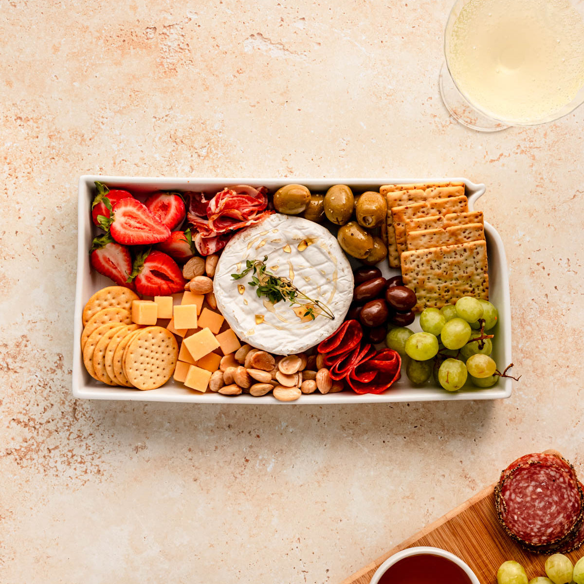 charcuterie board with cheese and cured meats in a Kansas shaped serving tray platter dish