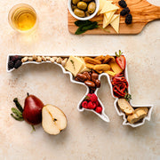 charcuterie board with cheese and cured meats in a Maryland shaped serving tray platter dish