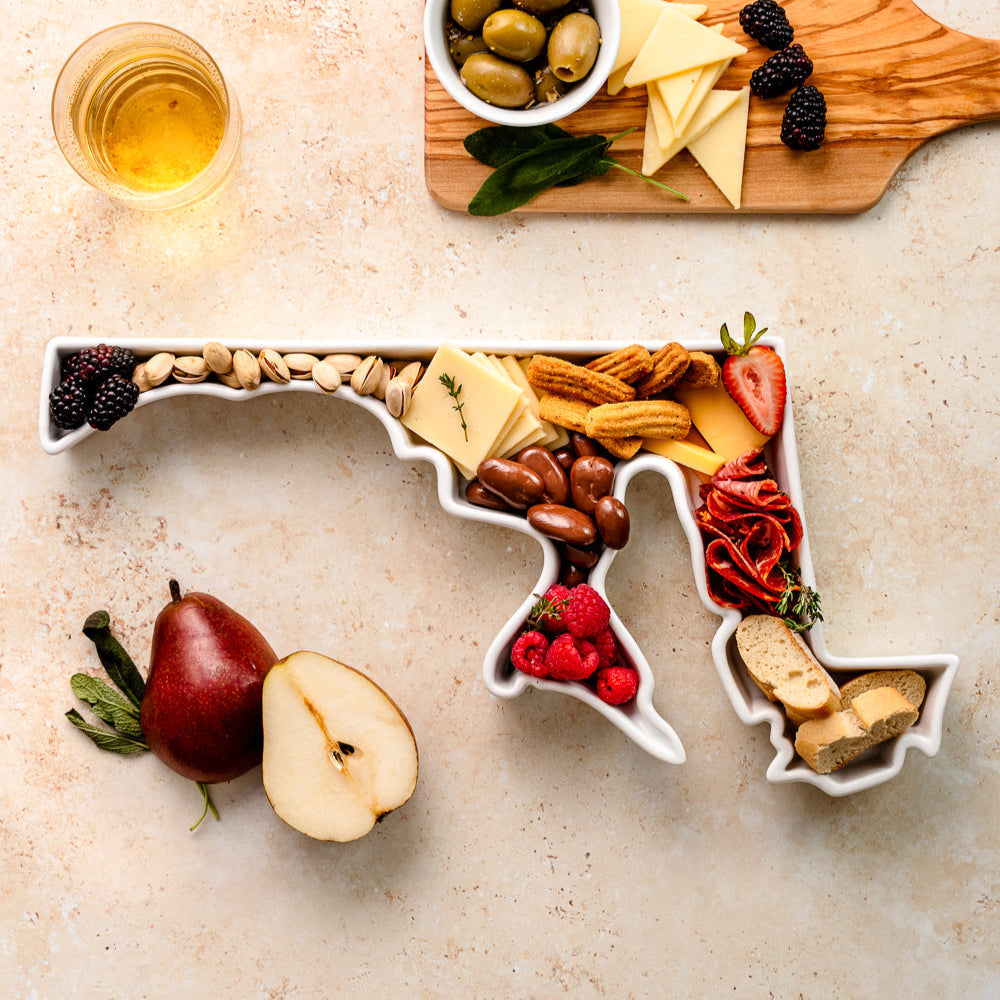 charcuterie board with cheese and cured meats in a Maryland shaped serving tray platter dish