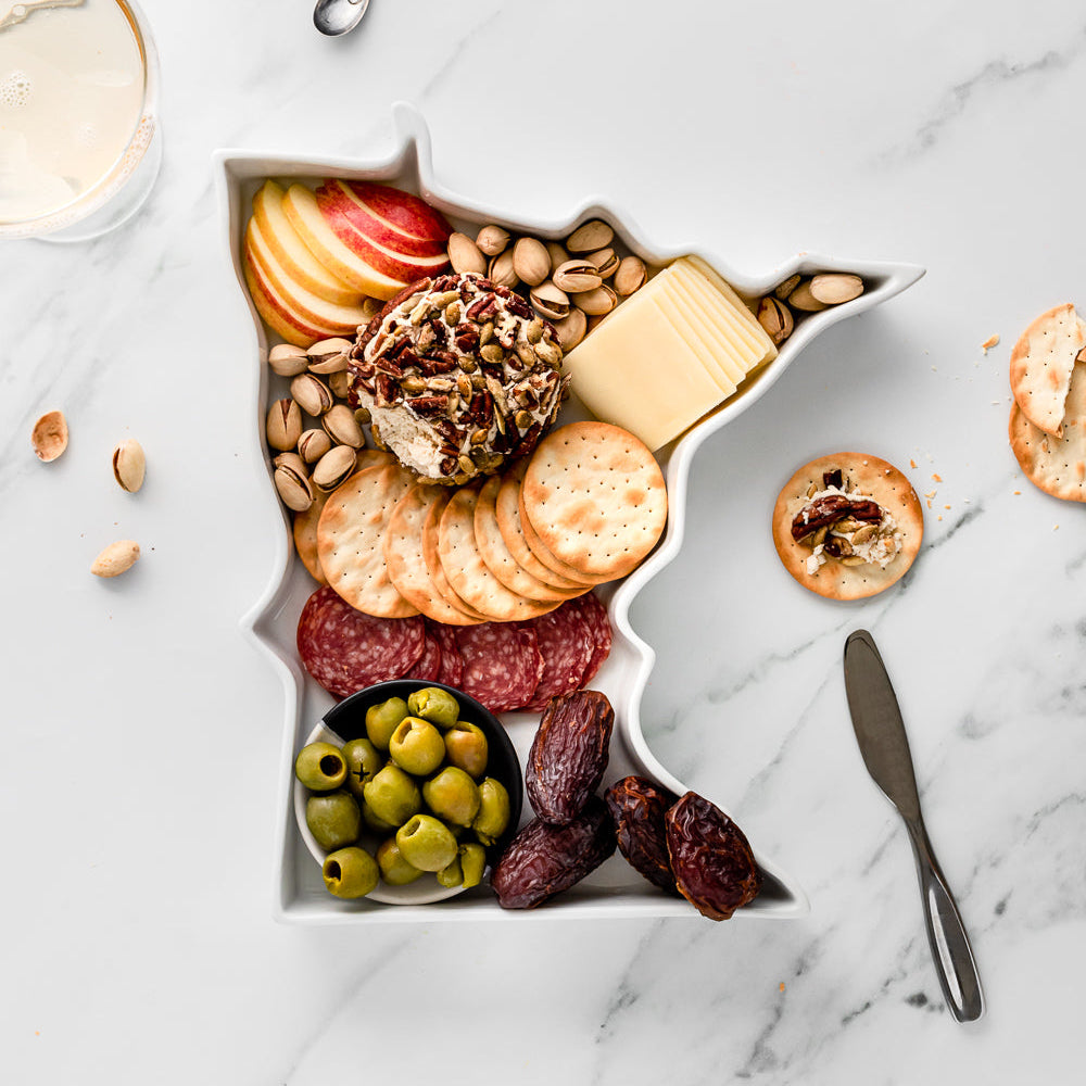 charcuterie board with cheese and cured meats in a Minnesota shaped serving tray platter dish