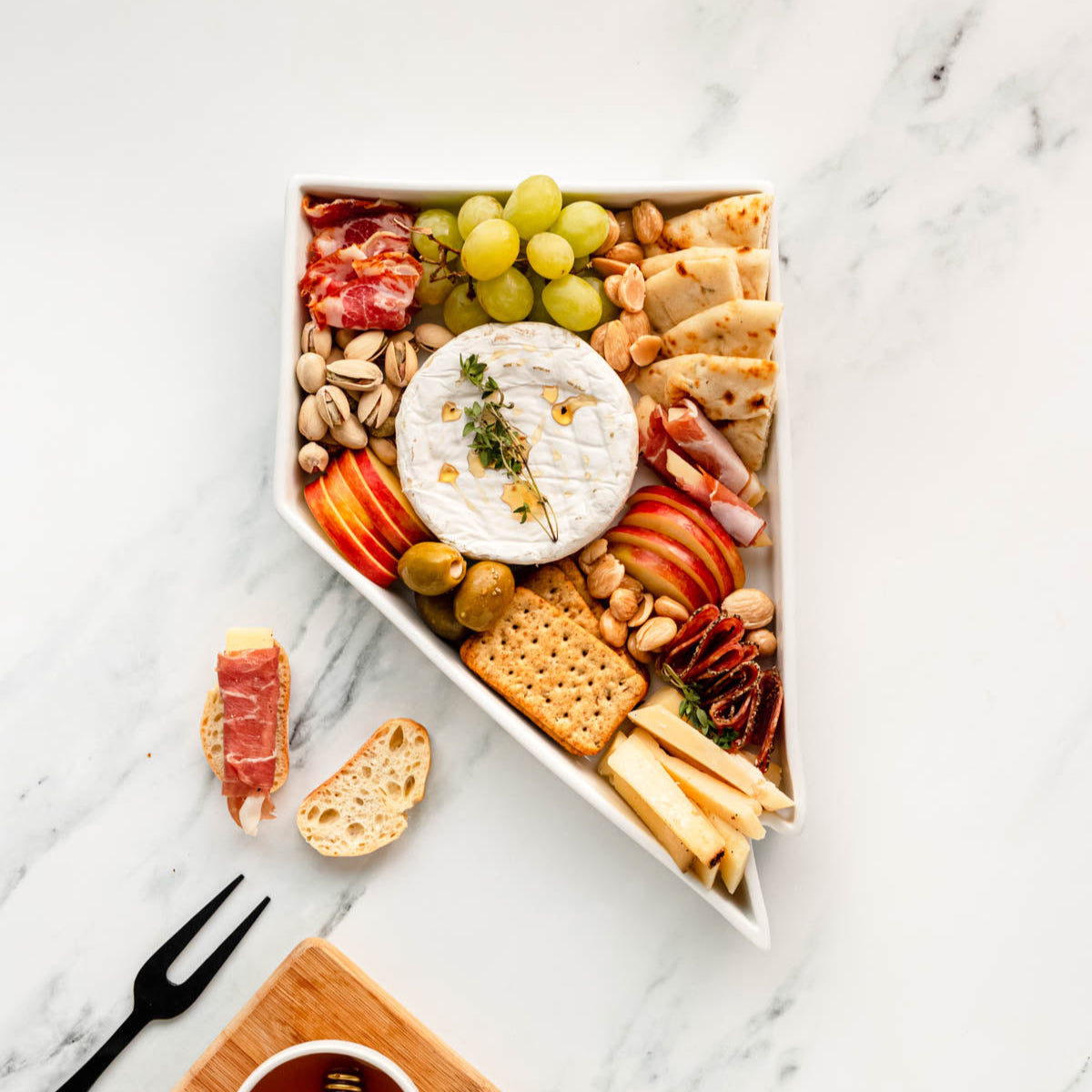charcuterie board with cheese and cured meats in a Nevada shaped serving tray platter dish