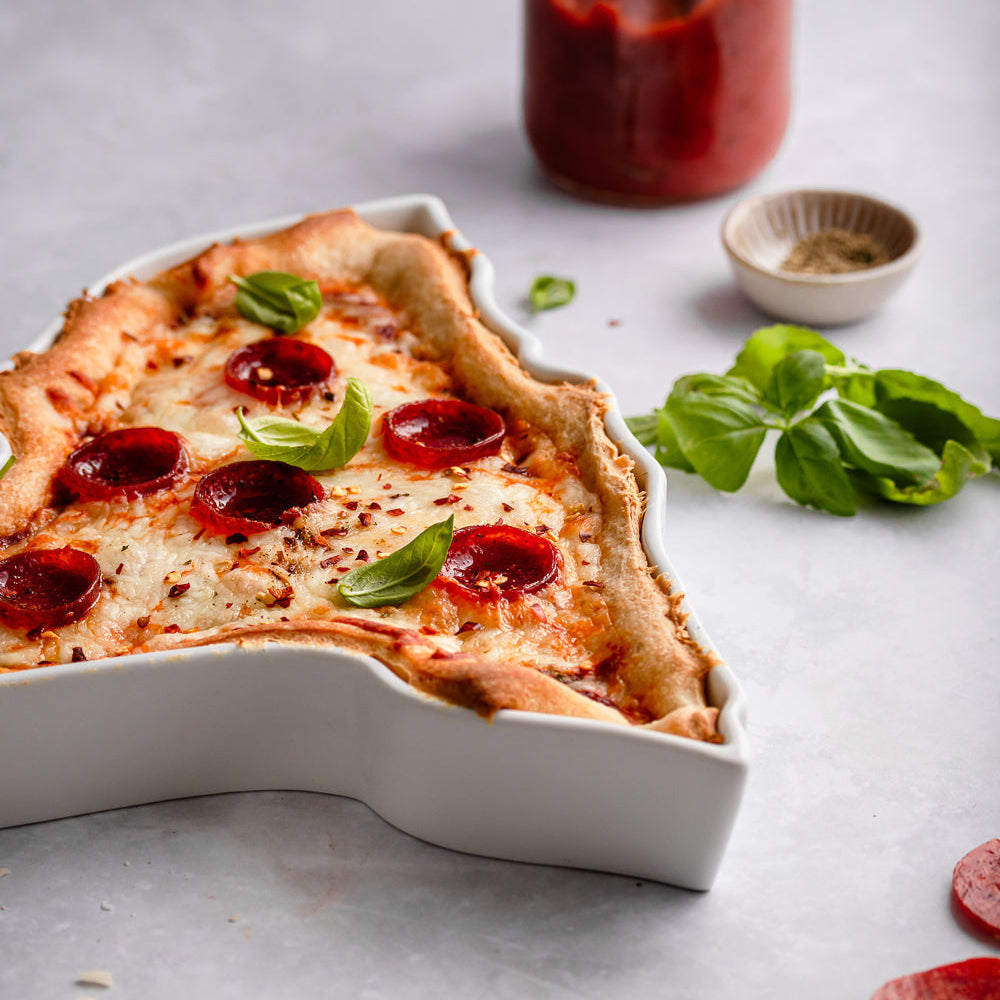 New York style pizza in NY State Plate. New York baking dish. New York pizza dish. New York bakware. NY bakeware. NY pizza tray. NY pizza gift. NY baking gift. NY ceramic gift. State plate shown up close, unique silhouette ceramics.