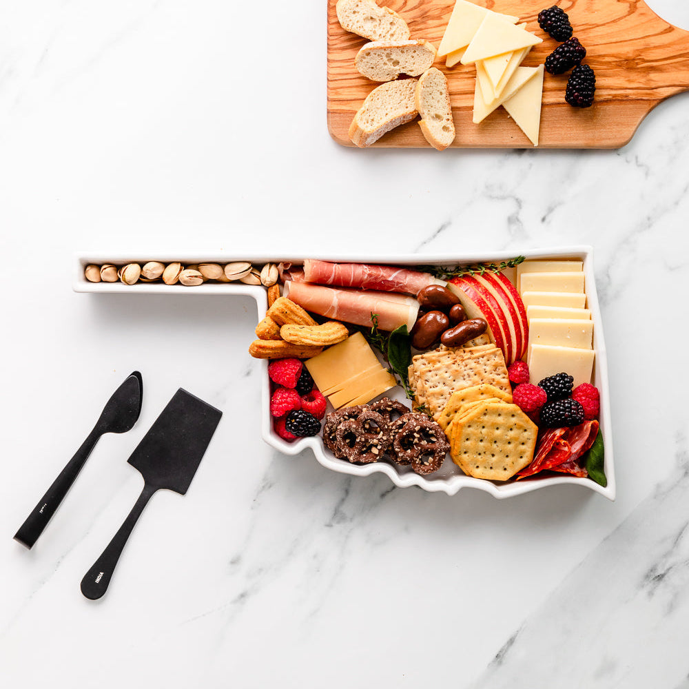 charcuterie board with cheese and cured meats in a Oklahoma shaped serving tray platter dish