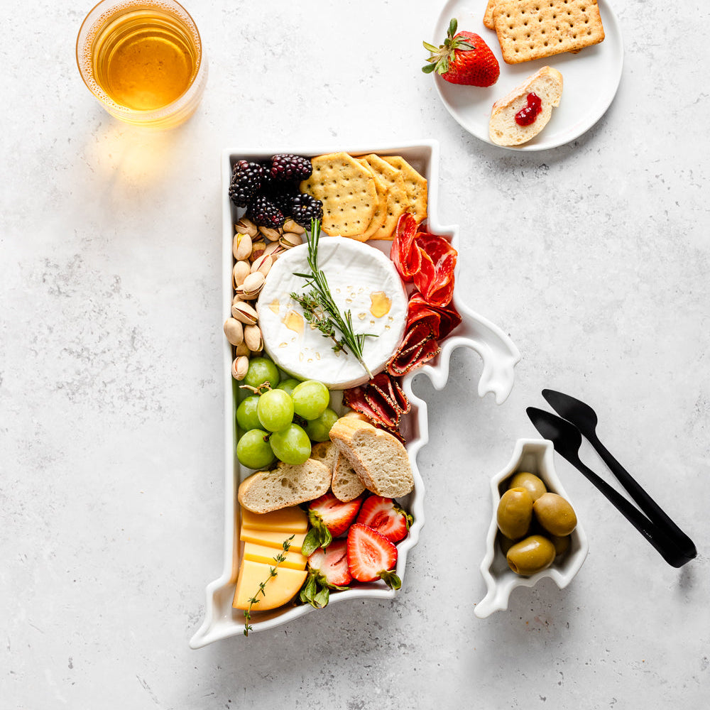 charcuterie board with cheese and cured meats in a Rhode Island shaped serving tray platter dish