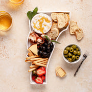 charcuterie board with cheese and cured meats in a Vermont shaped serving tray platter dish